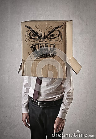 Angry businessman with a box on his head Stock Photo