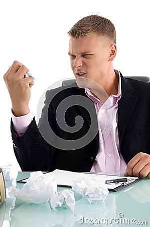 Angry businessman crushing the paper Stock Photo