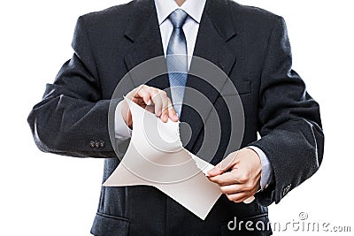 Angry businessman hand tearing paper document Stock Photo