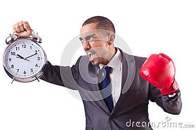 Angry businessman hitting clock isolated Stock Photo