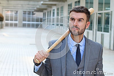 Angry businessman holding baseball bat Stock Photo