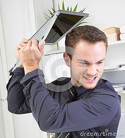 Angry Businessman with PC problems Stock Photo