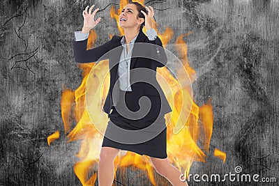 Angry businesswoman gesturing against fire Stock Photo