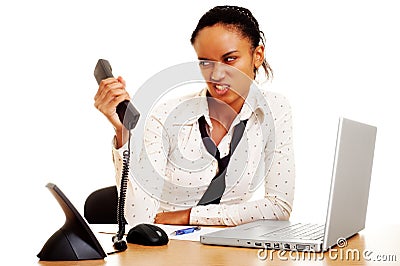 Angry businesswoman with phone Stock Photo