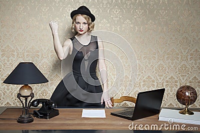 Angry businesswoman threatens fist Stock Photo