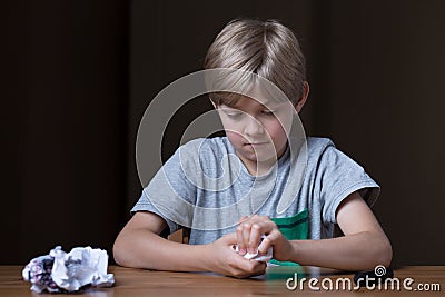 Angry child destroying his drawing Stock Photo