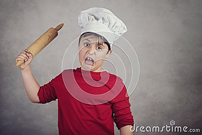 Angry cook child Stock Photo