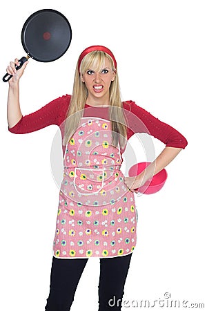 Angry cook girl holding frying pan Stock Photo