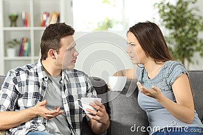 Angry couple arguing at home Stock Photo