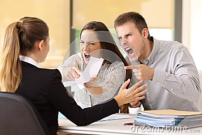 Angry couple claiming at office Stock Photo