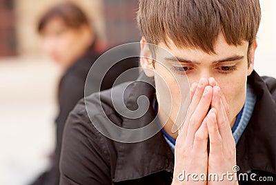 Angry couple sitting on bench Stock Photo