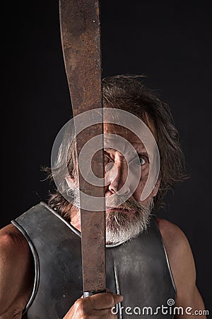 Angry and crazy old bearded warrior Stock Photo