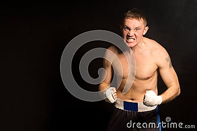 Angry determined young boxer Stock Photo