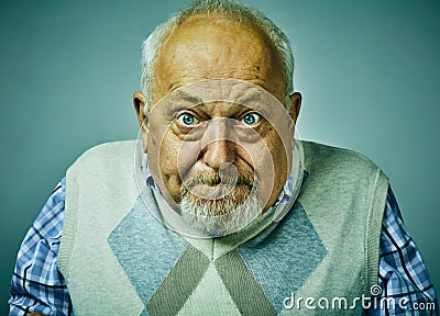 Angry disgruntled senior man face expression. Stock Photo