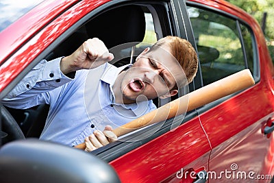 Angry Driver With Baseball Bat Screaming Stock Photo