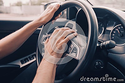 Driver presses the horn of the car to attract the attention of the car bully and avoid road accident. Stress and aggressive Stock Photo