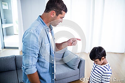 Angry father scolding his son Stock Photo