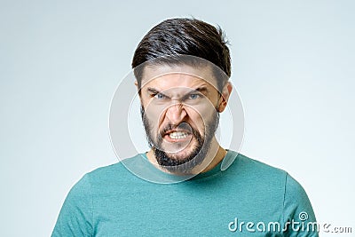 Angry and furious male on a gray background Stock Photo