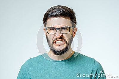 Angry and furious male on a gray background Stock Photo