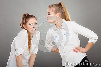 Angry fury girl screaming at her friend or younger sister Stock Photo