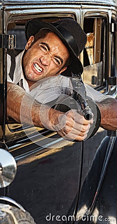 Angry Gangster Shooting Gun Stock Photo