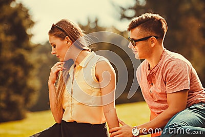 Angry girl rejects her boyfriend. Stock Photo