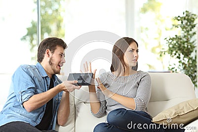 Angry girlfriend rejecting a gift Stock Photo