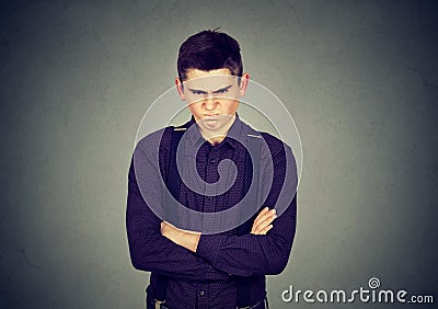 Angry grumpy man looking very displeased Stock Photo