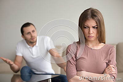 Angry husband mad at wife, unhappy woman frustrated, family conf Stock Photo