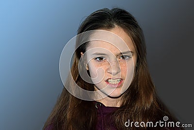 Angry looking teenage girl seeks revenge Stock Photo