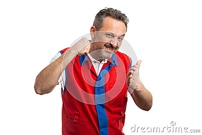 Supermarket employee starting fight with intimidating gesture Stock Photo