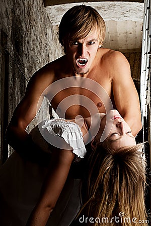 Angry, male vampire wants to bite his prey Stock Photo