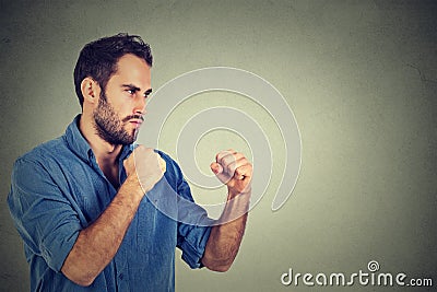 Angry man clenching his fists Stock Photo