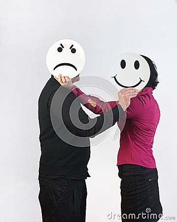 angry man and a happy woman with a plate in the face Stock Photo