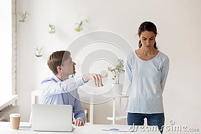 Angry middle aged boss firing unhappy incompetent worker. Stock Photo