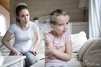 Angry mother scolding little sad preschool daughter Stock Photo