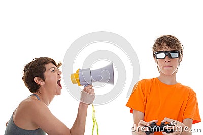 Angry mother of teen playing computer games Stock Photo