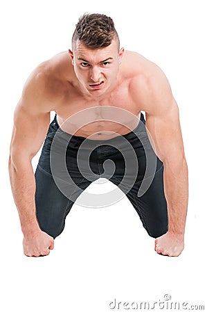 Angry muscular male model on all four Stock Photo