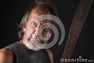 Angry old bearded warrior with mad look Stock Photo