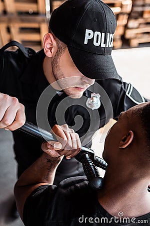Angry police officer in cap with Stock Photo