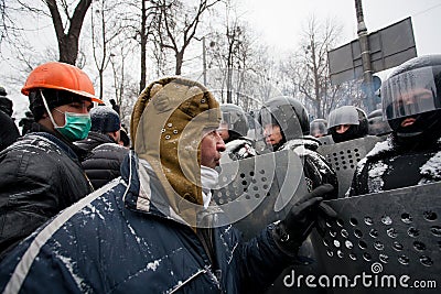 Angry protester in a military helmet arguing with Editorial Stock Photo