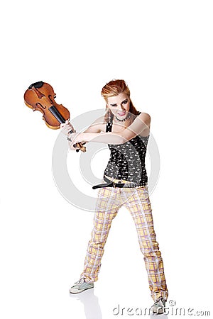 Angry punk girl intending to break her fiddle. Stock Photo