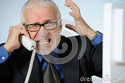 Angry senior businessman Stock Photo