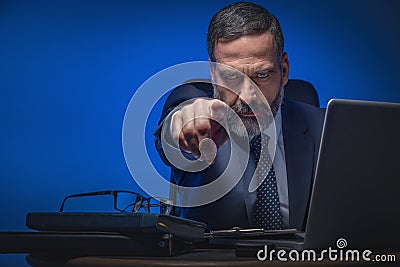 Evil senior business man pointing finger Stock Photo