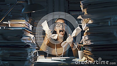 Angry stressed office worker overloaded with paperwork Stock Photo