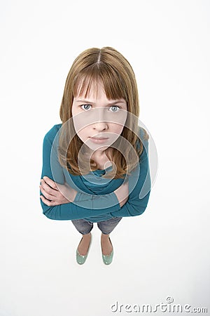 Angry Teenage Girl With Hands Folded Stock Photo