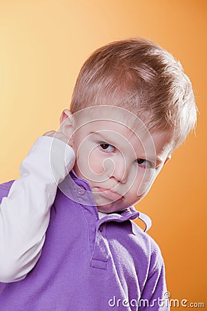 Angry upset little boy showing fist Stock Photo