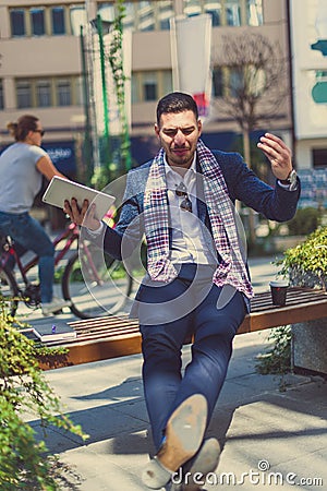 Angry urban guy sitting and arguing Stock Photo