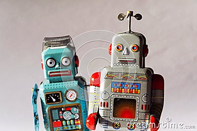 Angry vintage tin toy robots, artificial intelligence, robotic delivery concept Stock Photo