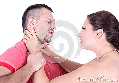 Angry wife try to strangle unfaithful husband Stock Photo